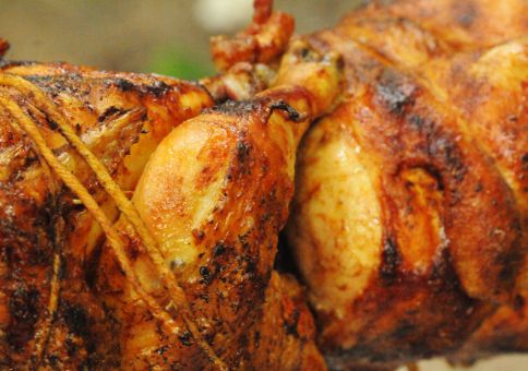 163) Cook on a fire rotisserie style 