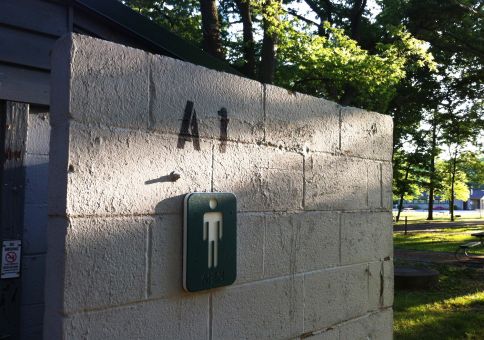 143) Write on a bathroom stall door